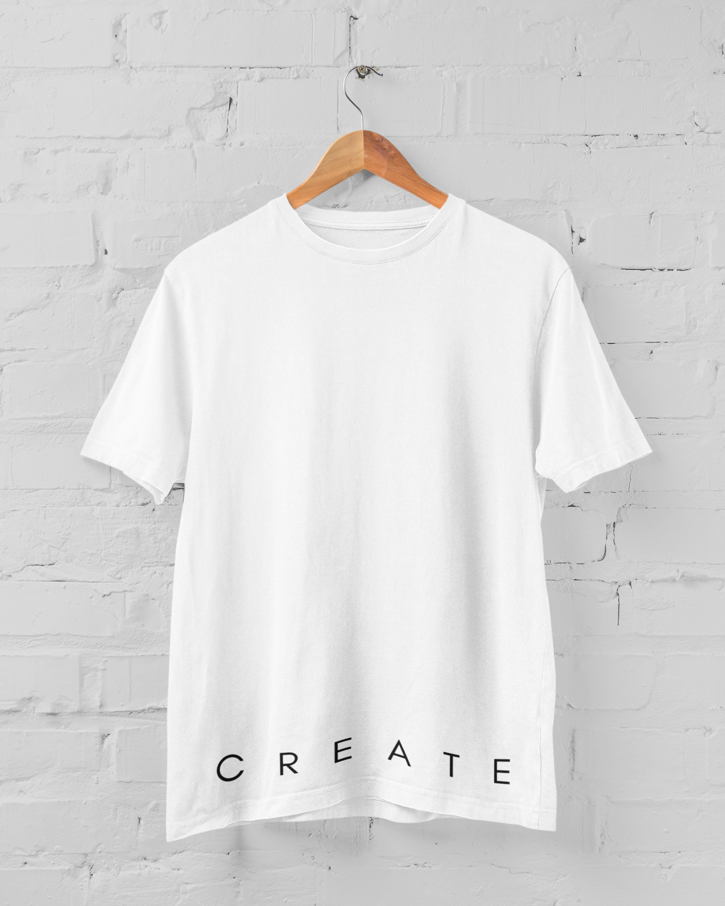 C R E A T E unisex t-shirt in various colors, showcasing its stylish fitted sleeves and durable fabric.